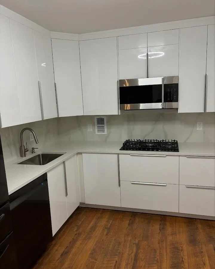 Restored kitchen with white cabinets after water damage in Fort Lee